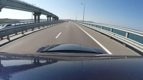View of highway from moving blue car. Vineyard is on left side. Go pro is on Stock Footage 123722982
