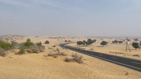 View of Highway road between the dry desert area of Jaisalmer Rajasthan. Stock Footage 282791044