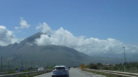 View of the highway towards a cloud-covered peak. Stock-Footage 308185944