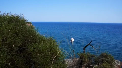 View from hill to Mediterranean Sea in Phaselis with yacht. City of ancient Stock Footage 107980947