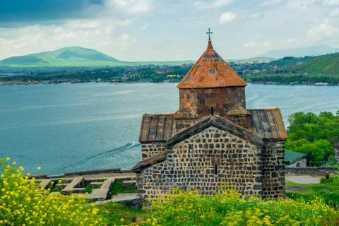 View from the hill to the monastery Sevanavank, Lake Sevan and the city of Se 스톡 사진