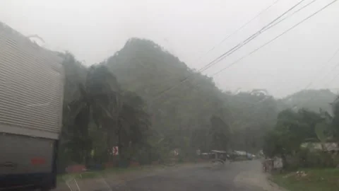 View of hill mountain from car while driving on a rainy day Stock Footage 161078062