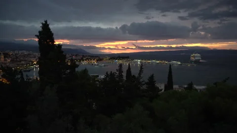 View from the hill on Split and cloudy sunrise and city lights, Croatia - 4K Stock Footage 168312025