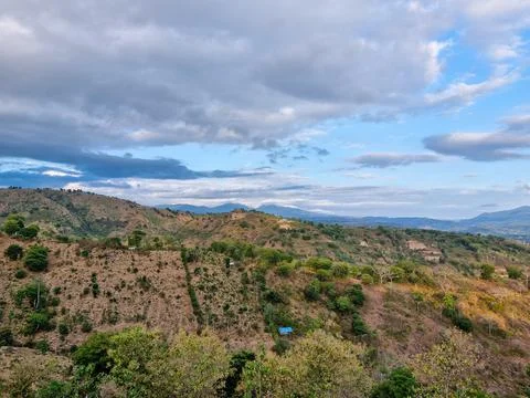 View of hills with cloudy sky background Stock Photos