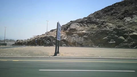 The view of the hills on the road with the background of the blue sky Stock Footage 130296309