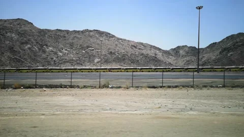 The view of the hills on the road with the background of the blue sky Stock Footage 130296375