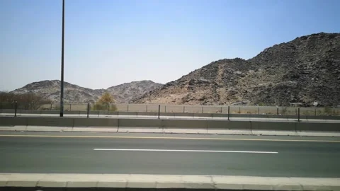 The view of the hills on the road with the background of the blue sky Vídeos de archivo 130296436