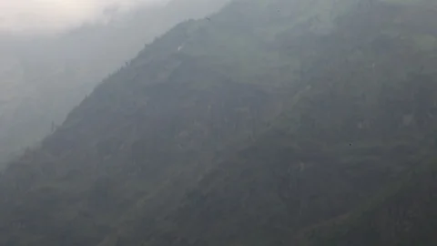 View of Himalayan mountains, which swoops down to reveal lake far below. Stock Footage 86758190