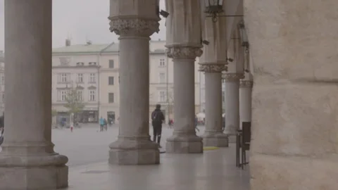 View of historic arcade columns in Krakow main square Stock Footage 342558262