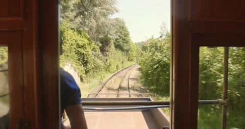 View from Historic Tramway Window Passing Green Landscape near Turin, Italy Stock Footage 340072388