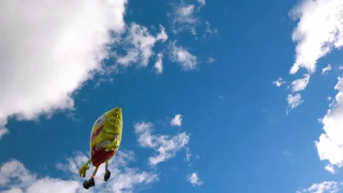 View of holiday foldable sponge Bob figure on blue sky Stock Footage 190913141
