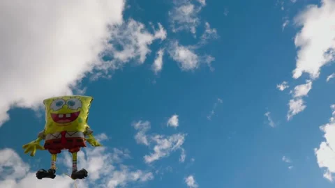 View of holiday foldable sponge Bob figure on blue sky Stock Footage 203009498