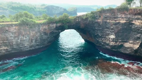 View of hollow cliff at broken beach, Nusa penida tourism in Bali Stock Footage 295324756