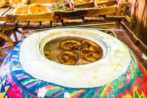 View on home made lavash bread being baked inside a traditional Armenian floor Stock Photos