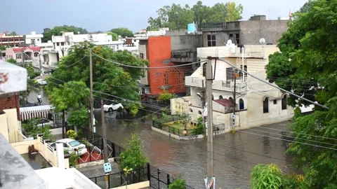 View of homes and road in rainy day of monsoon in Khanna, Punjab Indian Stock Footage 155179905
