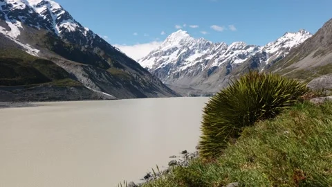 View of Hooker Lake with Mount Cook's snowy on a clear sunny summer day in Stock Footage 304502316