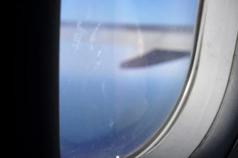 View of horizon line with sunset and wing from airplane Stock Photos