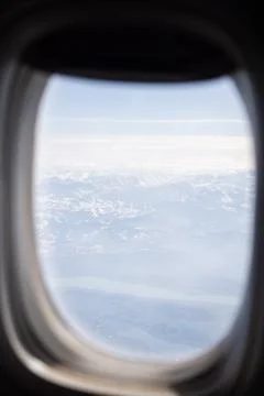View of the horizon from the window of a high-altitude airplane Stock Photos