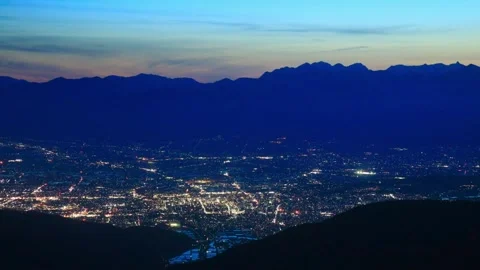 View of the Hotaka Mountain Range and Matsumoto City Nightscape from Mount Vídeo Stock 333184602