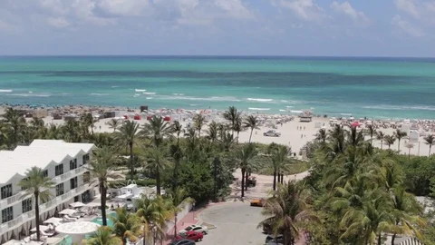 View from Hotel to Beach with Tourists Below Stock Footage 76356357