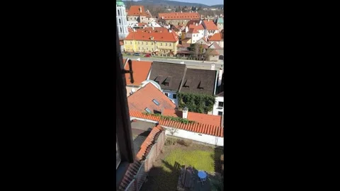 View from the hotel window of the courtyard and the city of Cesky Krumlov on a Stock Footage 302484371
