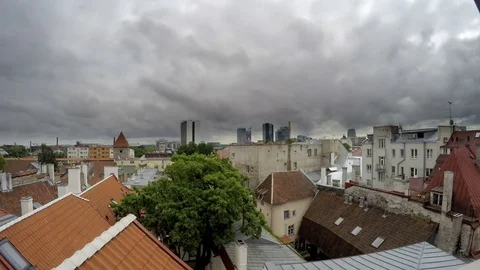 View from a house dormer-window in the old city to Tallinn, Estonia.Time lapse. Stock Footage
