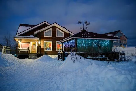 View of the house on a winter evening. Stock Photos
