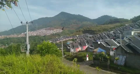View of the housing complex at the foot of another hill Stock Footage 219781952
