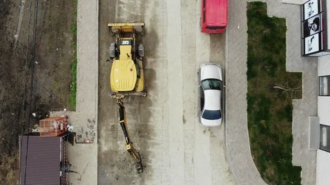 View of how the tractor works with a hydraulic hammer from dron. Stock Footage 125344953