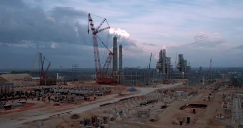 View of a huge tower crane and a plant under construction. Video stock 138218138