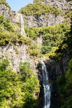 View of a huge waterfall in the middle of a levada Stock Photos