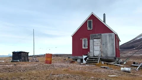 View of icebergs and mountains in the distance at a coastal village in Greenland Stock Footage 339999786