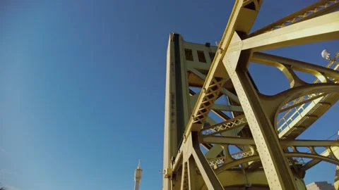 View of the iconic golden Tower Bridge against a clear blue Sacramento sky Stock Footage 326374544