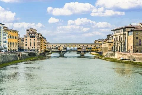 View of the iconic Ponte Vecchio, over the Arno River, in Florence, Italy. . Stock Photos