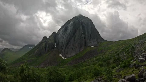 View of iconic Segla mountain peak with rocky slope foreground in Senja Norway Video stock 342059378
