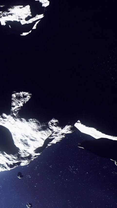 View of icy surface of a comet in dark space during a planetary mission Stock Footage 339959225