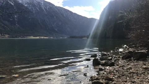 View idyllic Alpine mountains and lake Hallstattersee. Sunny winter morning in A Stock Footage 130055556