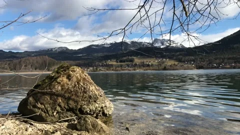 View idyllic Alpine mountains and lake Hallstattersee. Sunny winter morning in A Stock Footage 130567610