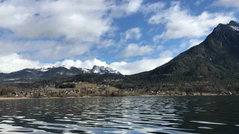 View idyllic Alpine mountains and lake Hallstattersee. Sunny winter morning in A Stock Footage 130567612