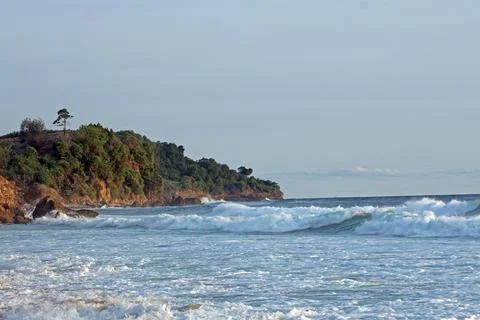 View of the idyllic Indonesian coast of Java Island with majestic mountains.. Stock Photos