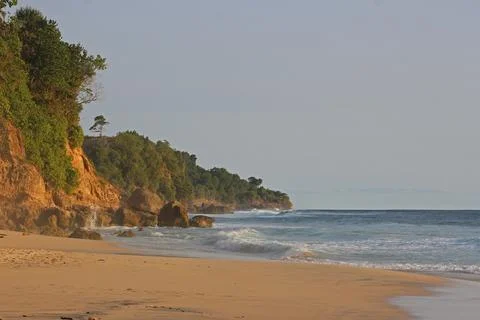 View of the idyllic Indonesian coast of Java Island with majestic mountains.. Stock Photos