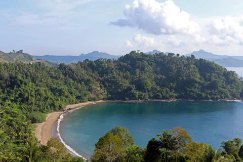 View of the idyllic Indonesian coast of Java Island with majestic mountains.. Stock Photos