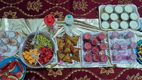 View of iftar food spread during Ramadan showcasing traditional dishes and .. Stock-Footage 334793011