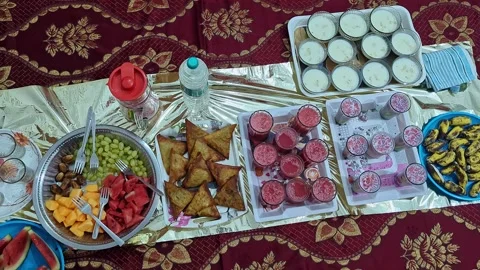 View of iftar food spread during Ramadan showcasing traditional dishes and .. 스톡 동영상 334793055