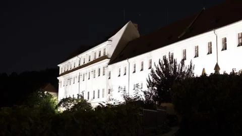 View of an illuminated building with shadows of tree leaves on the walls Stock Photos