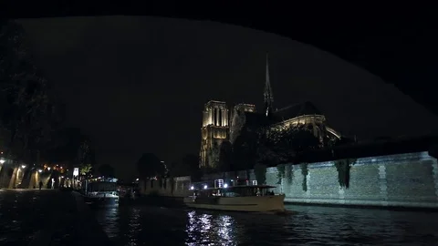 View of illuminated Notre-Dame de Paris cathedral at night Stock Footage 73961152