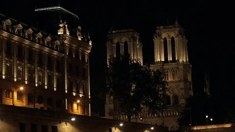 View of illuminated Notre-Dame de Paris cathedral at night Stock Footage 73961221