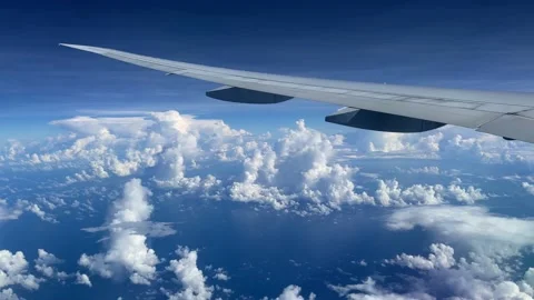 View from the illuminator of the big plane to the ocean and clouds. Stock Footage 163904475