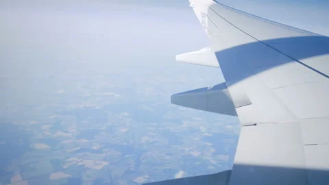 View from the illuminator to wing of the plane Stock Footage 100066433