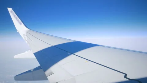 View from the illuminator to wing of the plane Stock Footage 100067684